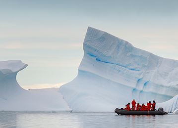 Zodiac craft near iceberg, Antarctica