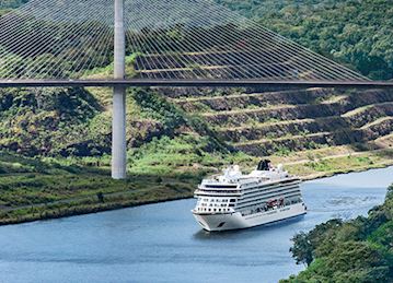 A Viking ocean ship sailing under Panama's Centennial Bridge