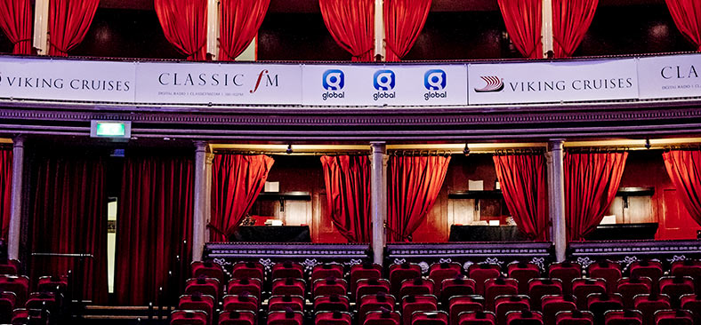 Classic FM and Viking Cruises banners on theater balcony