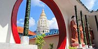 Kek Lok Si Temple in George Town seen through a red and white archway