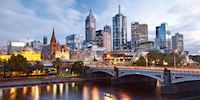 Melbourne skyline with a mix of old and new buildings across a bridge