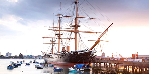 HMS Warrior Ship with large masts in Portsmouth, England.