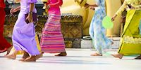Women walking in front of Shwedagon Pagoda